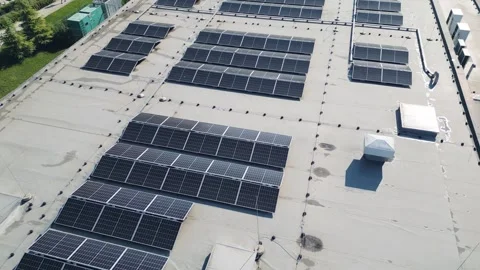 Aerial view of solar panels installed on building flat roof green energy power Stock Footage 346233543