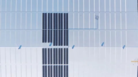 Aerial view of solar panels on a large industrial roof Stock Footage 341272255