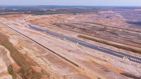 Aerial view of solar panels in an open pit mine 動画素材 342813113
