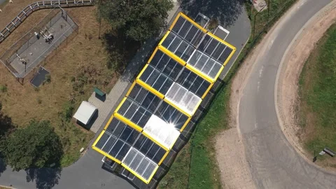 Aerial view of solar panels powering an electric car charging station Stock Footage 341874724