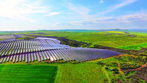 Aerial view of solar panels stretching over green valley, Bulgaria Stock Footage 339007543