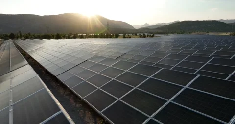 Aerial view of solar panels at sunset with dramatic sky Stock Footage 324509501