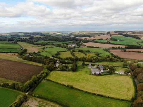 An aerial view of some patchwork rolling landscape with a mosaic of fields and Stock Photos