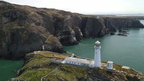 Aerial view of South Stack Lighthouse on the coast, United Kingdom. Stock Footage 337334434