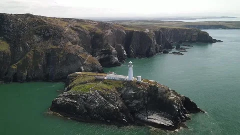 Aerial view of South Stack Lighthouse on the coast, United Kingdom. Stock Footage 337334450