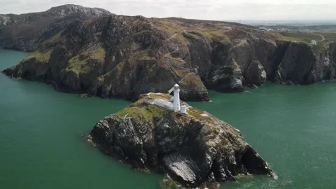 Aerial view of South Stack Lighthouse on the coast, United Kingdom. Stock Footage 337334467
