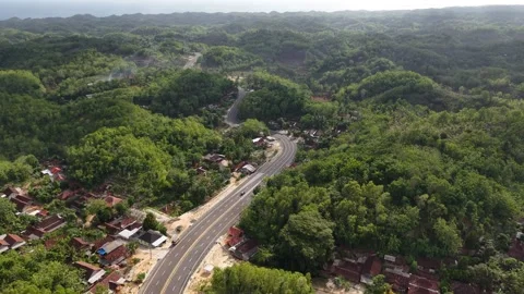 An aerial view of the southern ring road of Java Island, located in Gunungkidul Stock Footage 321663127