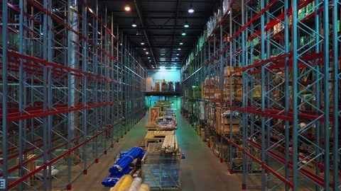 Aerial view of a spacious modern well-lit warehouse with metal structures Stock Footage 113091069