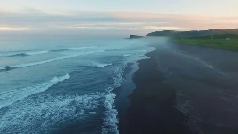 Aerial view. Span over the shore at sunset. The most beautiful flight over the Stock Footage 73660459