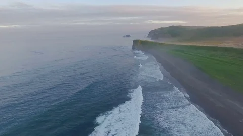 Aerial view. Span over the shore at sunset. The most beautiful flight over the Stock Footage 73660627