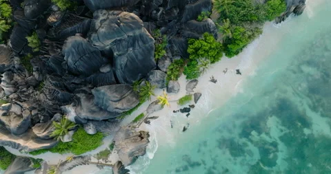 Aerial view of the spectacular Anse Source d'Argent beach, La Digue,Seychelles Stock Footage 221867552