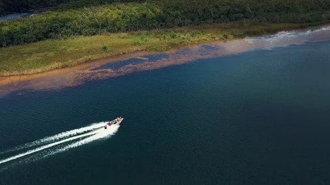 Aerial View of a Speed Boat Cruising down The Ord River in Western Australia Stock Footage