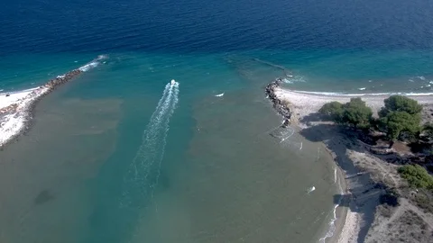 Aerial view of speedboat between two beaches, Glarokavos, Halkidiki Greece Stock Footage 115399501