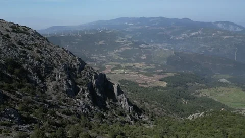 Aerial View of Spil Mountain with Wind Turbines in Distance Stock Footage 320454635