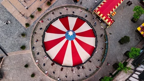 Aerial view of spinning carousel at an amusement park with people enjoying .. Stock Footage 335067450
