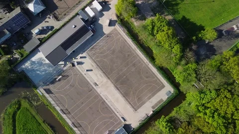 Aerial view of sports complex with two soccer courts, nearby buildings Stock Footage 309142202