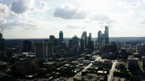 Aerial view of the sprawling Austin, Texas city with cars commuting to work in Stock Footage 333680515
