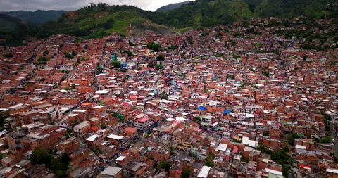 Aerial view of sprawling hillside favela in Medellin, Colombia Stock Footage 341432449