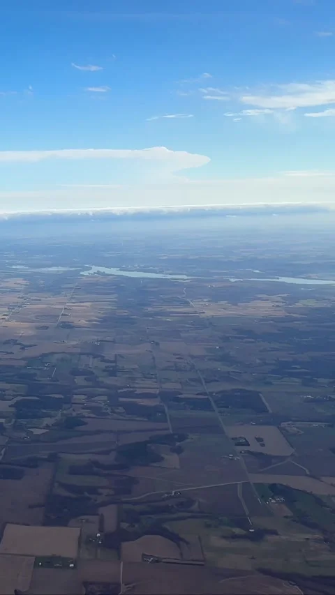 Aerial view of sprawling patchwork farmland landscape seen from a jetliner Stock Footage 333806417