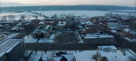 Aerial View Of St. Croix River Behind Buildings In Winter In Hudson Wisconsin Stock Footage 229761375
