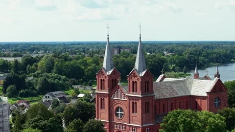 Aerial View of St. John the Baptist Church Plungė Lithuania with Scenic Video stock 345021247