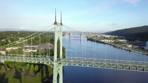 Aerial view of St. Johns Bridge and Portland Oregon skyline in the distance. Stock Footage