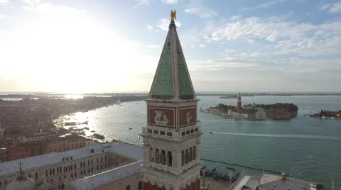 Aerial view of St Mark's Clocktower and the beautiful Venetian Lagoon in Venice Stock Footage