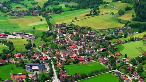 Aerial View of St. Peter am Kammersberg, a Picturesque Alpine Village in Austria Stock Footage 313330715