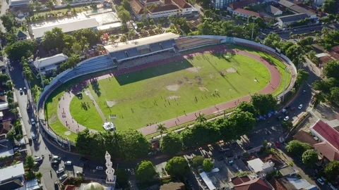 Aerial View of Stadium in The Middle of Busy Town Stock Footage 113447580