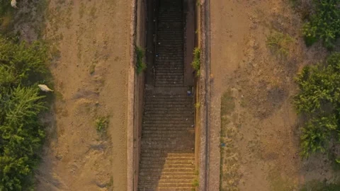 Aerial view of stairs going inside of a deep water well in Rohtas Fort,Pakistan Stock Footage 171178735