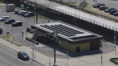 Aerial view of Starbucks drive thru cafe in the United Kingdom.  Stock Footage 309714110