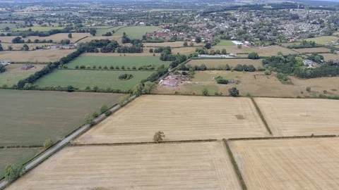 Aerial view, static and panning move. Kelsall small village among plains in C Stock Footage 95559633