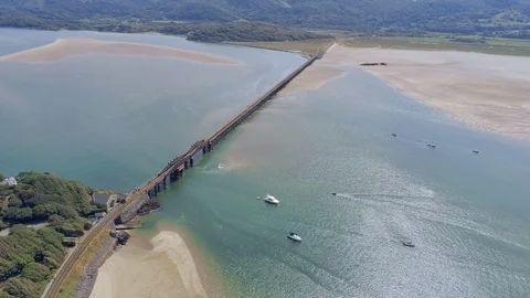 Aerial view, static. Drone panorama over rising tide sea, bay, anchored boats Stock Footage 94251790