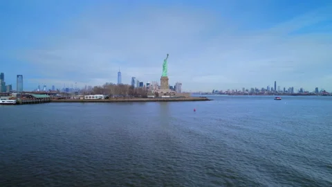 Aerial view of Statue Liberty on background of New York. Video stock 237633092