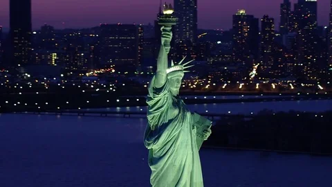 new york statue of liberty skyline at night