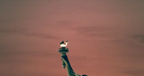 Aerial view of the Statue of Liberty torch, New York City, bright sunset light. Stock Footage 199459441