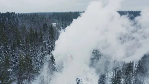 Aerial view steam from retro train in snowy forest Stock Footage 121465366