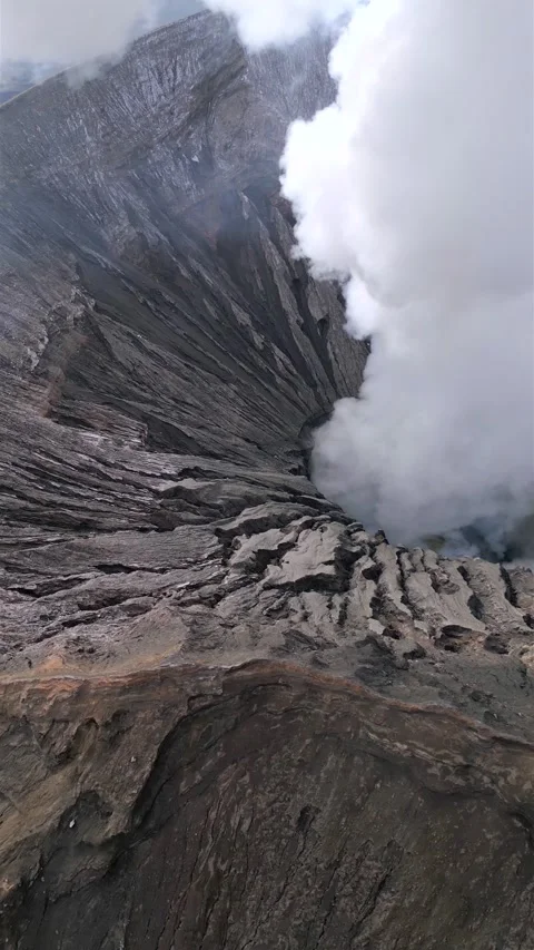 Aerial view of steaming Mount Bromo volcanic crater in East Java, Indonesia Stock-Footage 336560247