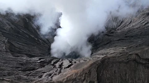 Aerial view of steaming Mount Bromo volcanic crater in East Java, Indonesia Stock-Footage 336683246