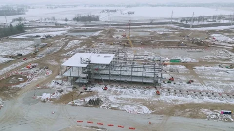 Aerial View of Steel Structure Construction Site in Winter Stock Footage 345099841