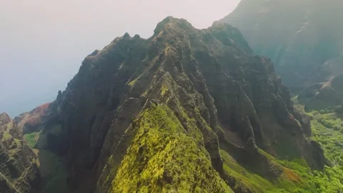 Aerial view of steep cliff and green mountain ridge Stock Footage 345833571