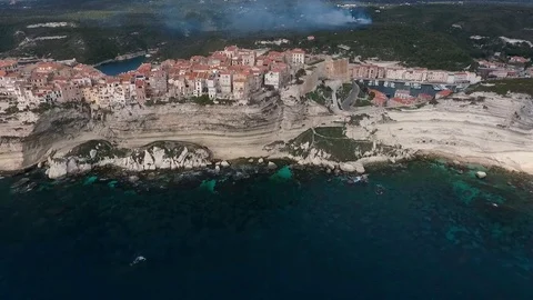 Aerial view of the steep cliffs and the city of Bonifacio on the island of Co Stock Footage 112409346