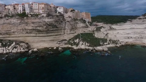 Aerial view of the steep cliffs and the city of Bonifacio on the island of Co Stock Footage 112409613