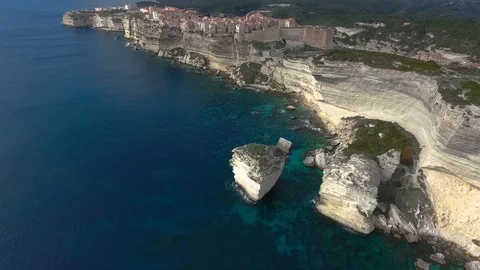 Aerial view of the steep cliffs and the city of Bonifacio on the island of Co Stock Footage 112444094