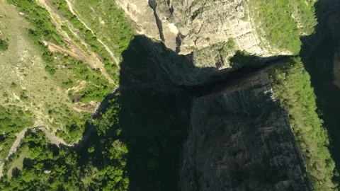 Aerial View of the Steep Cliffs and Deep Chasm of Karadakh Gorge, Dagestan, Cauc Stock Footage 325813691