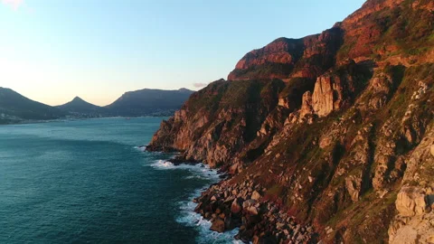 Aerial view of the steep cliffs of Chapman's peak running into the ocean Stock Footage 170579081
