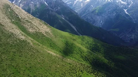 Aerial view of steep green mountain slopes with cloud shadows in Kazakhstan Vídeo Stock 337147973