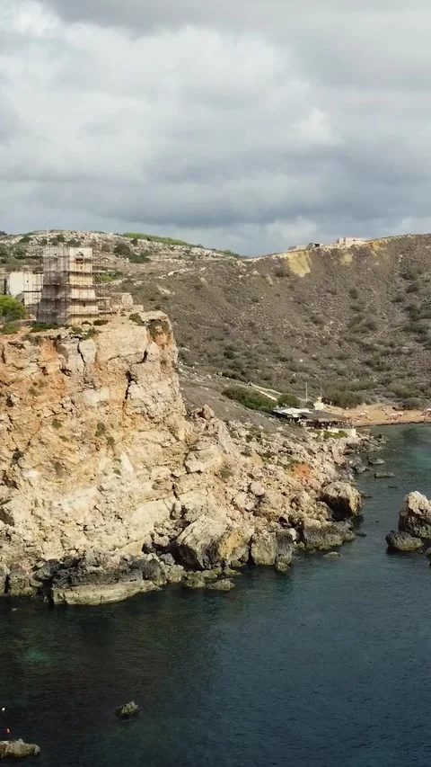 Aerial view of the steep limestone coastline and azure Mediterranean water .. Stock Footage 327034997