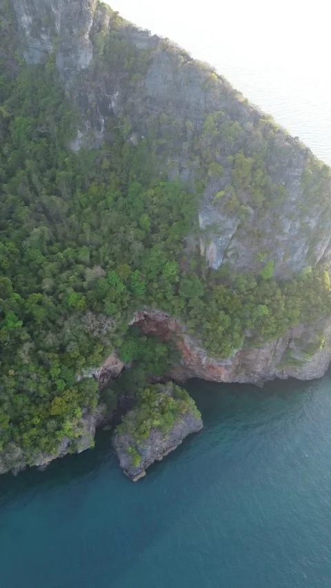 Aerial View of Steep Limestone Mountain Cliffs and Calm Sea Waters Stock Footage 344547820