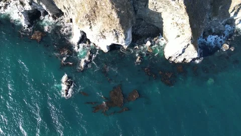Aerial View of Steep Rocky Cliffs and Ocean Waves in Big Sur California Video stock 318624865